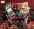 4563Q HOLLY BASKET - Quick Ship - This holiday basket is full of treats including chocolates, cocoa, toffee, and candles with a glass holder.